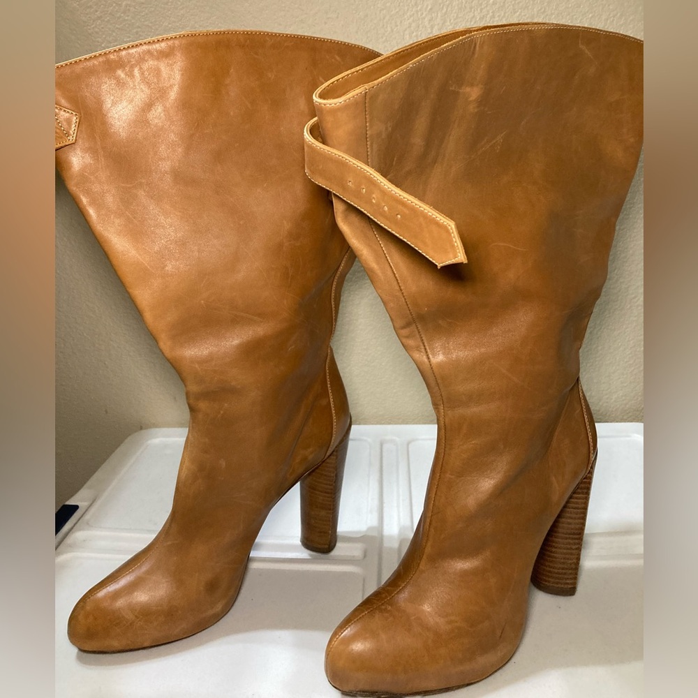 Boutique 9 tan leather healed boots size 7.5 and 4 inch heals.